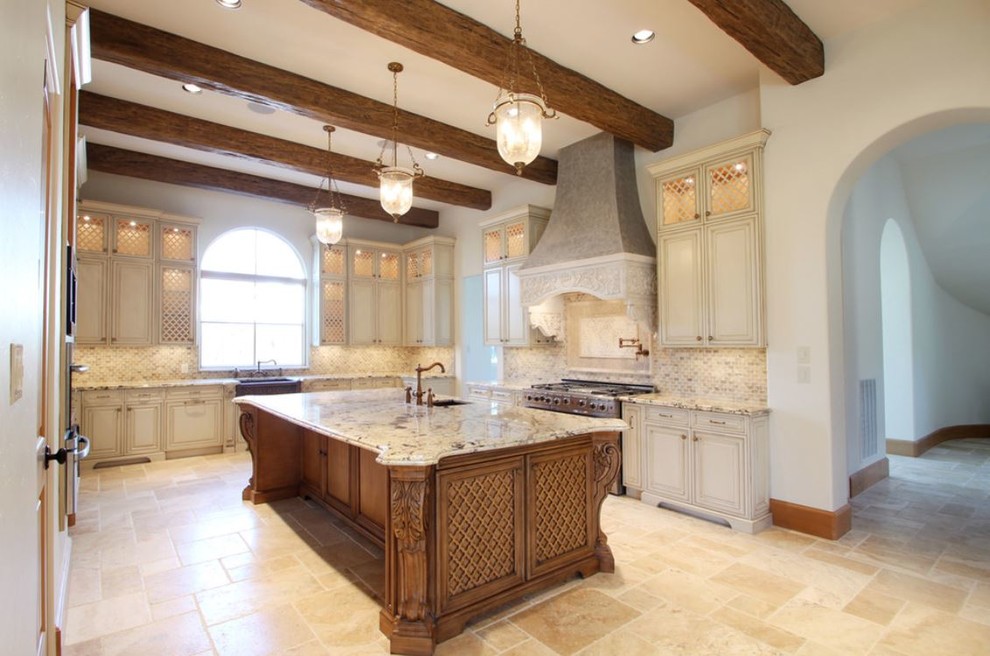 Large trendy u-shaped ceramic tile and beige floor eat-in kitchen photo in Houston with a farmhouse sink, raised-panel cabinets, beige cabinets, granite countertops, multicolored backsplash, mosaic tile backsplash, stainless steel appliances and an island