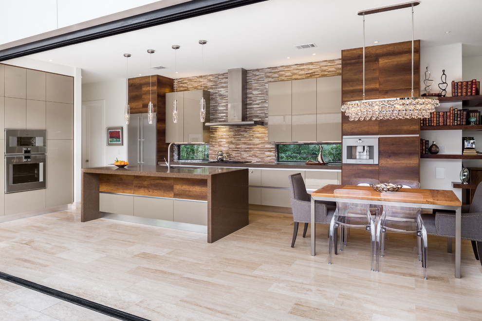 Inspiration for a mid-sized contemporary l-shaped travertine floor eat-in kitchen remodel in Austin with an undermount sink, flat-panel cabinets, gray cabinets, quartz countertops, multicolored backsplash, matchstick tile backsplash, stainless steel appliances and an island