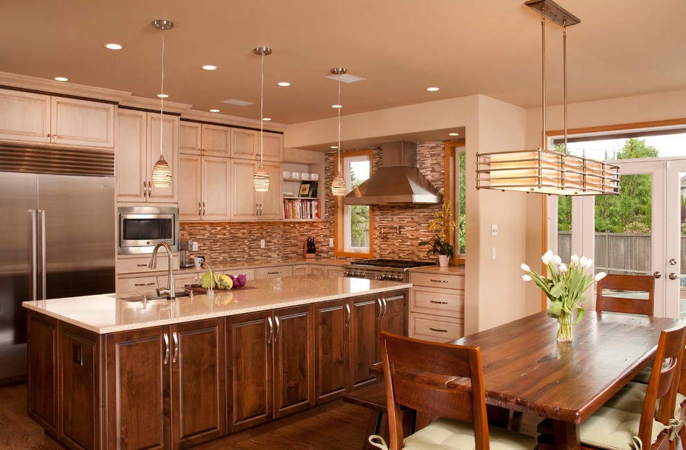 Large transitional l-shaped dark wood floor eat-in kitchen photo in Seattle with an undermount sink, raised-panel cabinets, light wood cabinets, quartz countertops, multicolored backsplash, stainless steel appliances and an island