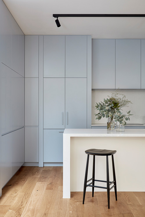 Create a Tranquil Atmosphere with Minimalist Kitchen Inspirations: Blue and White Kitchen with Wood Flooring