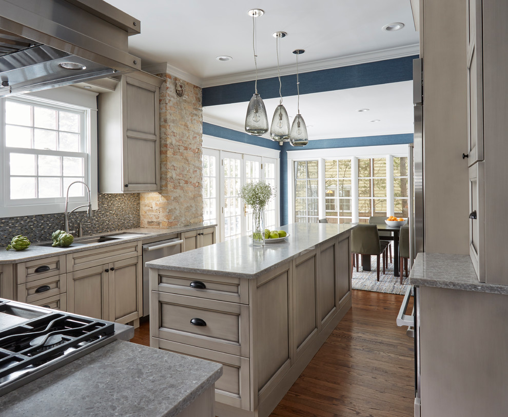Inspiration for a large timeless u-shaped medium tone wood floor and brown floor eat-in kitchen remodel in Chicago with a single-bowl sink, recessed-panel cabinets, gray cabinets, quartz countertops, metallic backsplash, mosaic tile backsplash, stainless steel appliances and an island