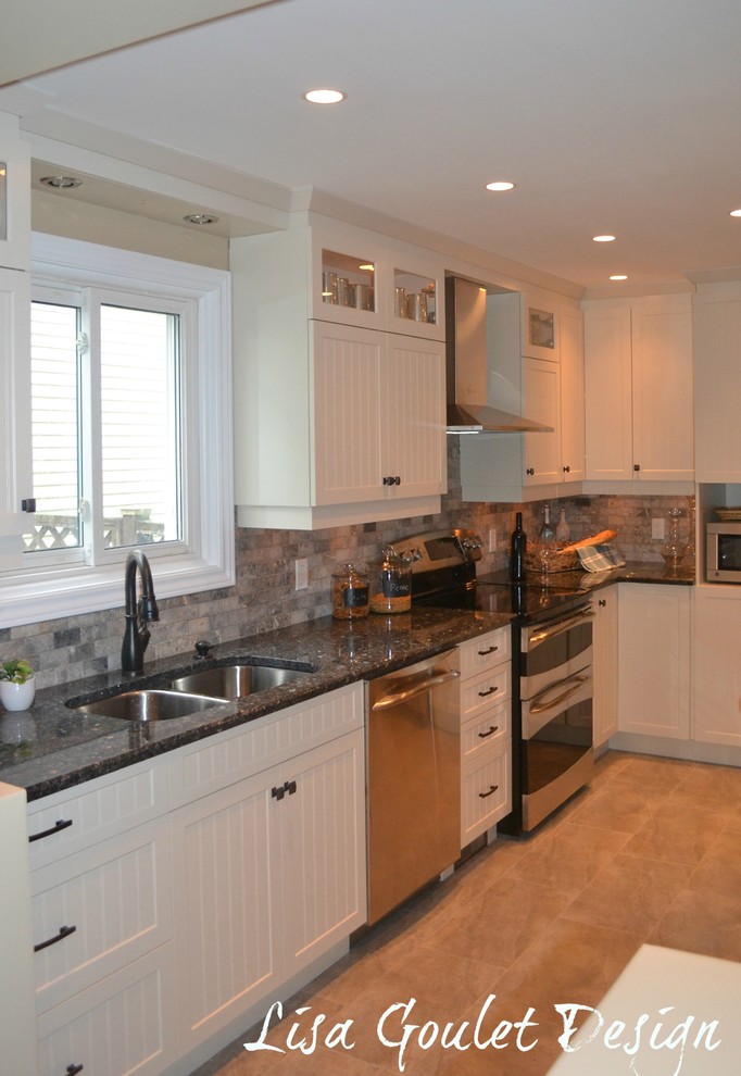 Photo of a medium sized contemporary u-shaped kitchen/diner in Ottawa with a submerged sink, shaker cabinets, white cabinets, granite worktops, grey splashback, marble splashback, stainless steel appliances, porcelain flooring, a breakfast bar, grey floors and blue worktops.