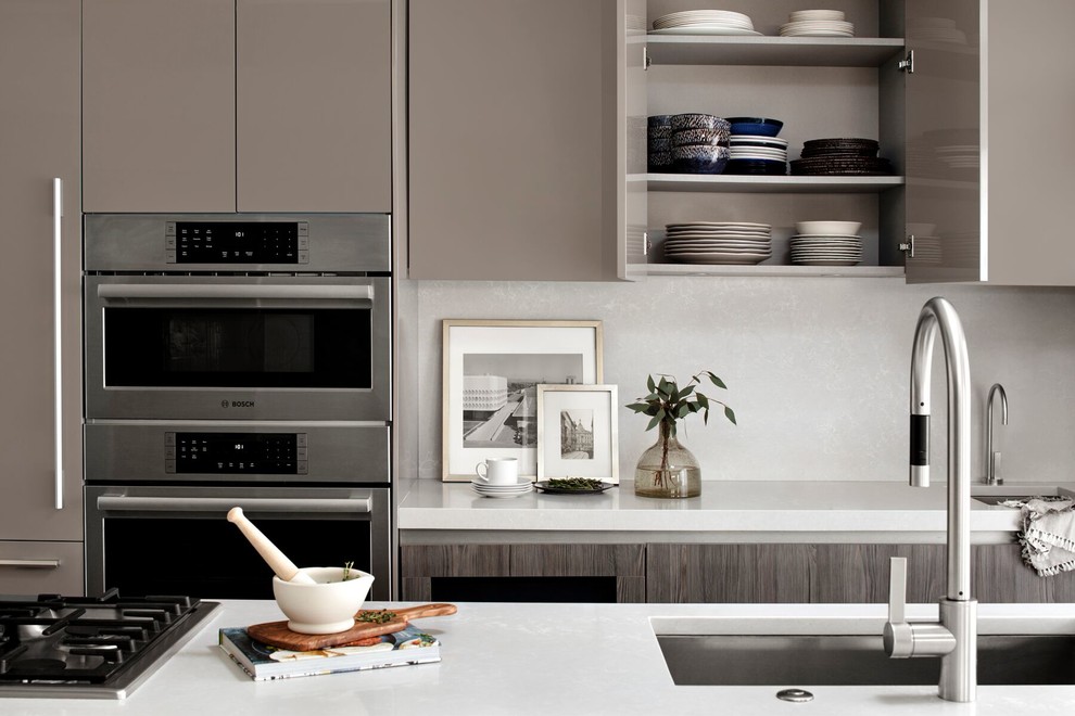 Inspiration for a medium sized contemporary kitchen in DC Metro with flat-panel cabinets and an island.