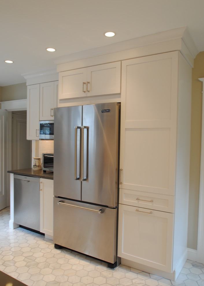 Example of a trendy marble floor eat-in kitchen design in Philadelphia with shaker cabinets, white cabinets, quartz countertops, stainless steel appliances and no island