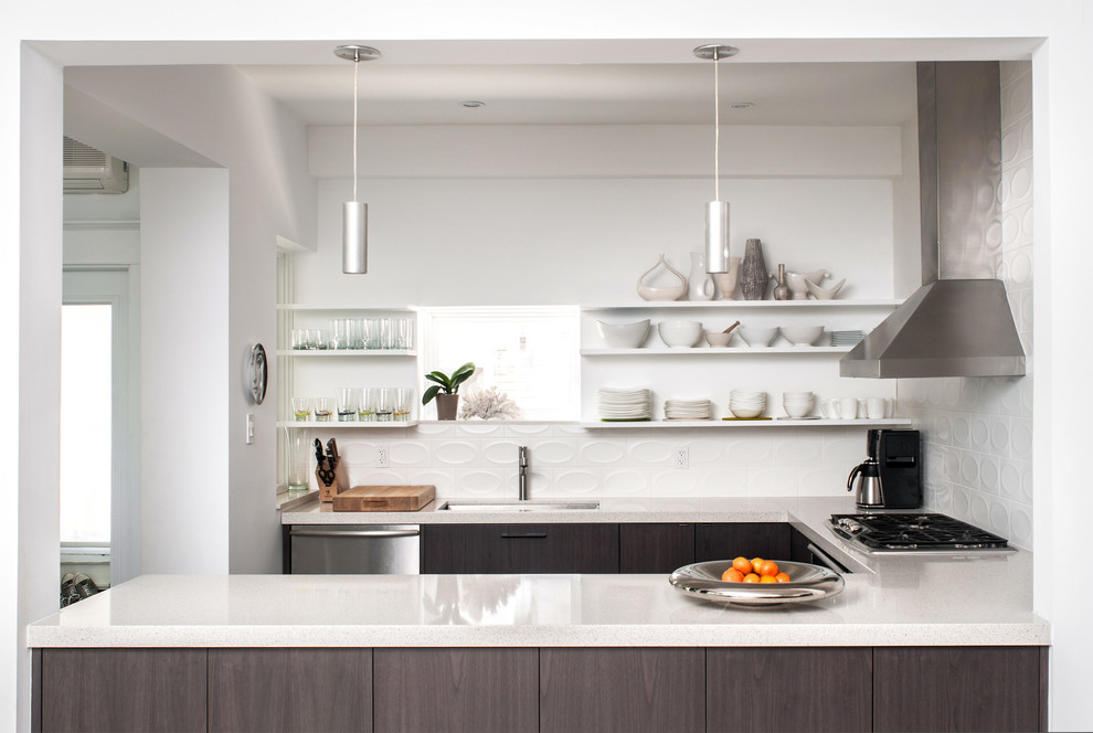 Example of a transitional u-shaped kitchen design in Toronto with an undermount sink, flat-panel cabinets, gray cabinets, white backsplash, stainless steel appliances and quartz countertops