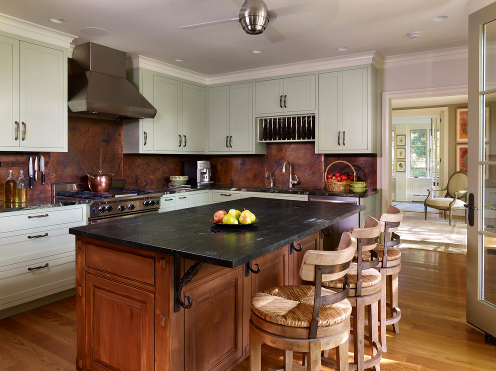 Inspiration for a mid-sized timeless medium tone wood floor kitchen remodel in Philadelphia with raised-panel cabinets, distressed cabinets and an island