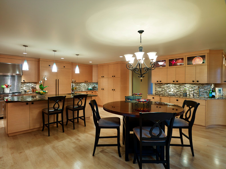 Large arts and crafts u-shaped light wood floor kitchen photo in Cleveland with a double-bowl sink, flat-panel cabinets, light wood cabinets, granite countertops, brown backsplash, ceramic backsplash, stainless steel appliances and an island