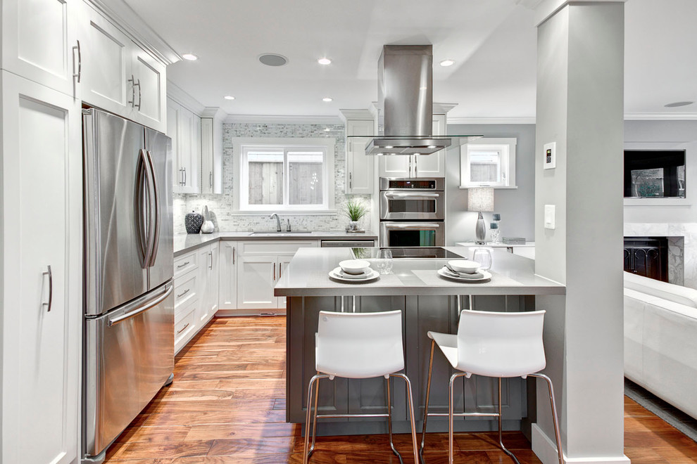 Design ideas for a contemporary grey and white kitchen in Vancouver with stainless steel appliances.