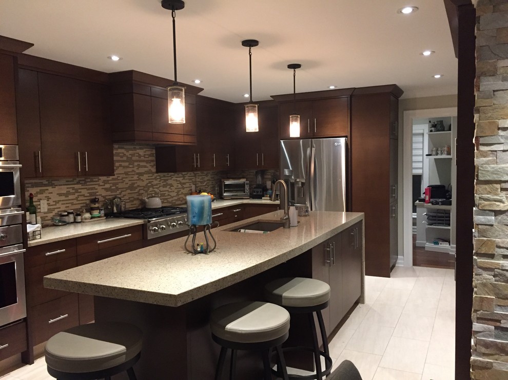 Photo of a medium sized traditional l-shaped kitchen in Ottawa with a submerged sink, flat-panel cabinets, dark wood cabinets, multi-coloured splashback, stainless steel appliances, porcelain flooring, an island and beige floors.