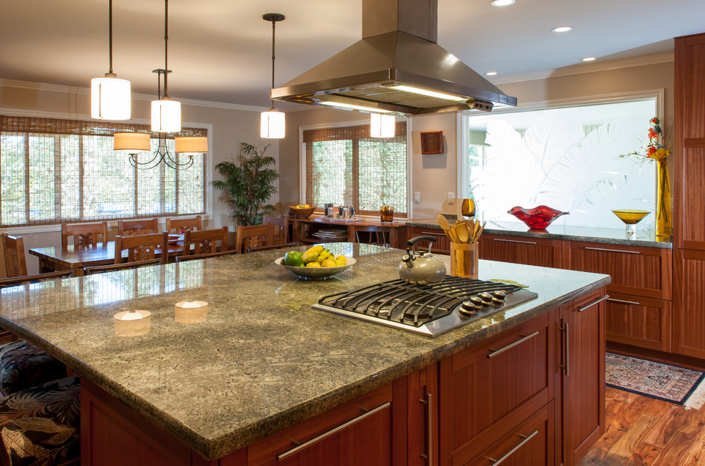 Mid-sized island style l-shaped eat-in kitchen photo in Hawaii with shaker cabinets, medium tone wood cabinets and granite countertops