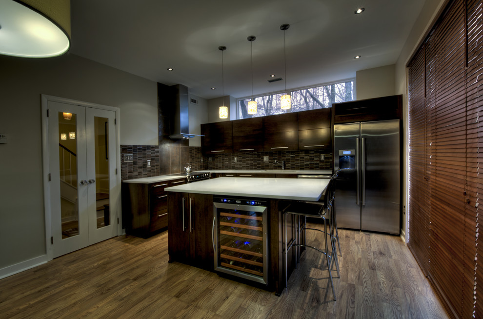 Inspiration for a mid-sized contemporary l-shaped medium tone wood floor open concept kitchen remodel in DC Metro with an undermount sink, flat-panel cabinets, dark wood cabinets, quartz countertops, multicolored backsplash, matchstick tile backsplash, stainless steel appliances and an island