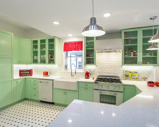 Design ideas for a medium sized classic l-shaped open plan kitchen in Chicago with a belfast sink, shaker cabinets, green cabinets, engineered stone countertops, white splashback, metro tiled splashback, white appliances, porcelain flooring and a breakfast bar.