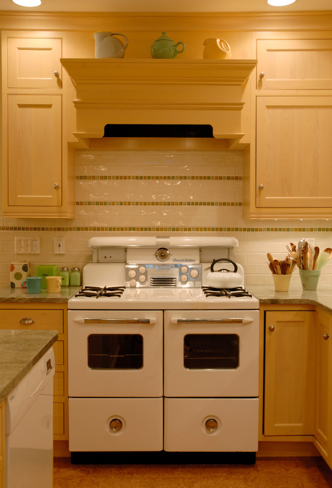 Mid-sized eclectic u-shaped eat-in kitchen photo in Boston with an undermount sink, recessed-panel cabinets, light wood cabinets, granite countertops, white backsplash, white appliances and an island