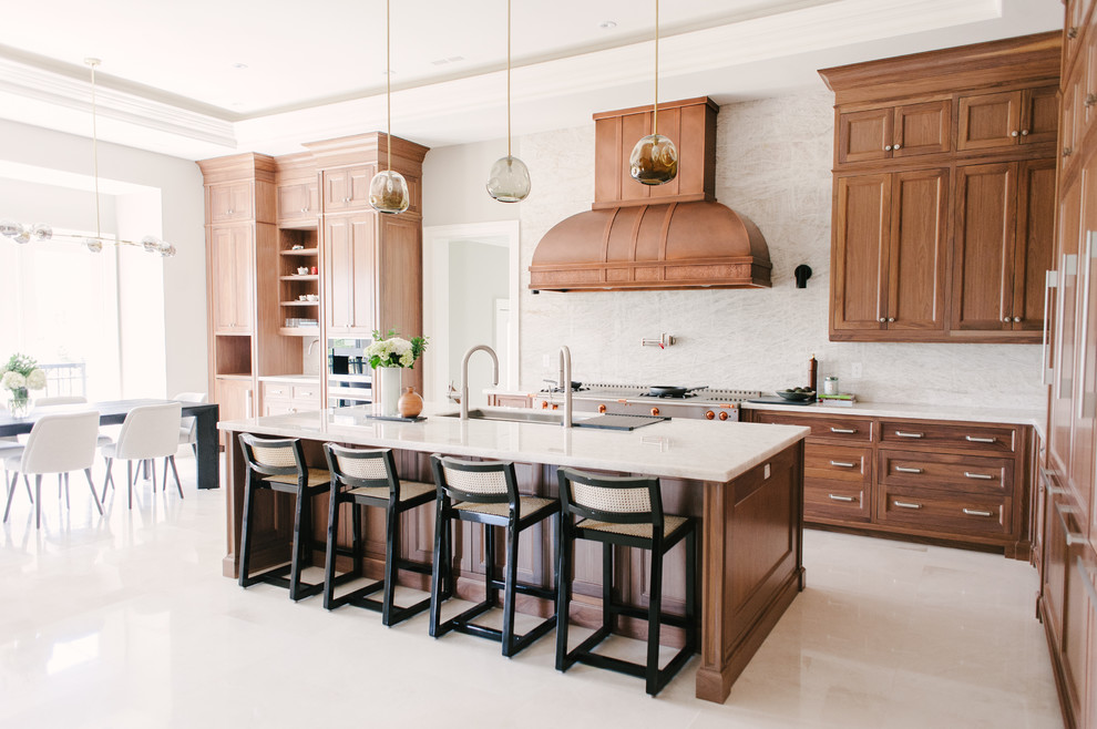 Large arts and crafts l-shaped porcelain tile and beige floor eat-in kitchen photo in Toronto with an undermount sink, shaker cabinets, medium tone wood cabinets, quartzite countertops, white backsplash, stone slab backsplash, paneled appliances, an island and white countertops