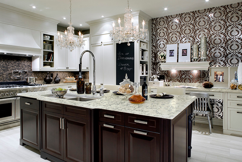 Example of a large transitional l-shaped slate floor kitchen design in New York with an undermount sink, raised-panel cabinets, dark wood cabinets, granite countertops, multicolored backsplash, mosaic tile backsplash, stainless steel appliances and an island