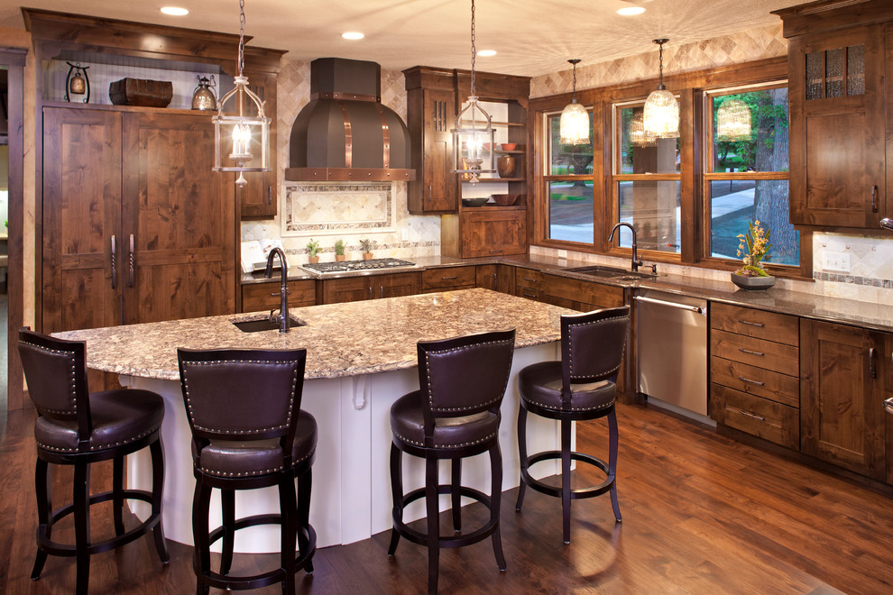Example of a mid-sized classic l-shaped medium tone wood floor and brown floor eat-in kitchen design in Minneapolis with an undermount sink, shaker cabinets, medium tone wood cabinets, quartz countertops, beige backsplash, porcelain backsplash, paneled appliances and an island