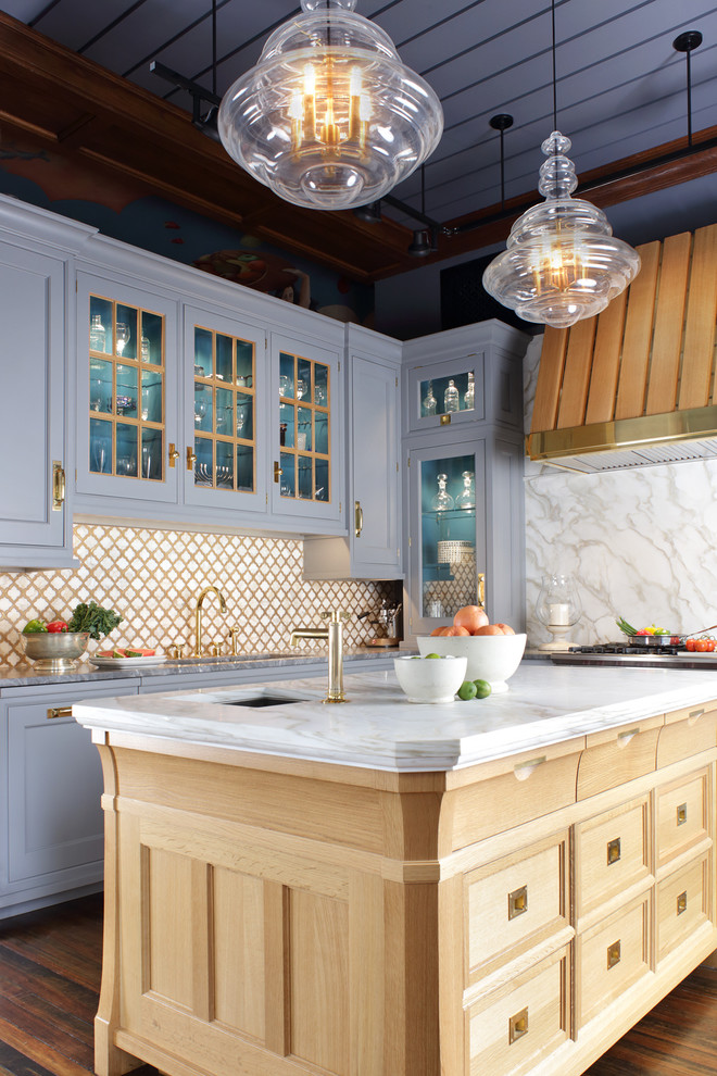 Example of a large classic l-shaped medium tone wood floor eat-in kitchen design in New York with an undermount sink, an island, beaded inset cabinets, gray cabinets, marble countertops, white backsplash, stone slab backsplash and stainless steel appliances
