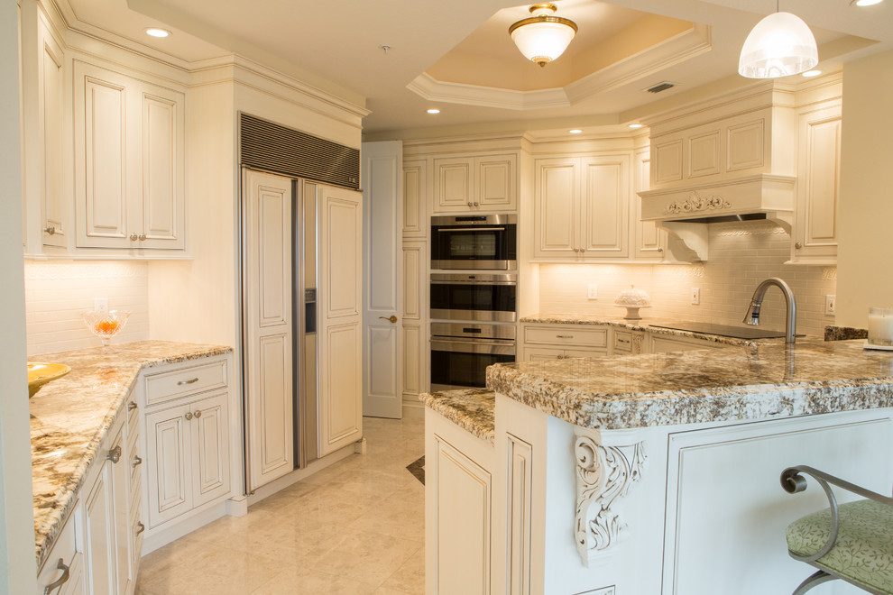 Kitchen - traditional kitchen idea in Tampa with beaded inset cabinets