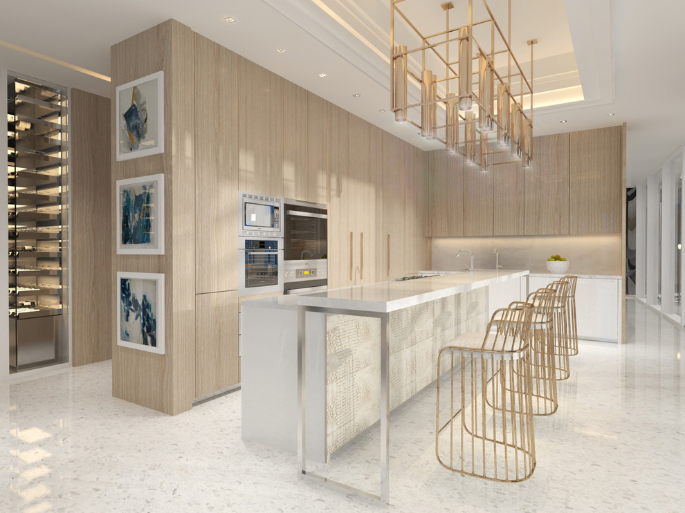 Cette image montre une grande cuisine américaine parallèle et encastrable minimaliste avec un placard à porte plane, des portes de placard beiges, plan de travail en marbre, îlot et un sol blanc.