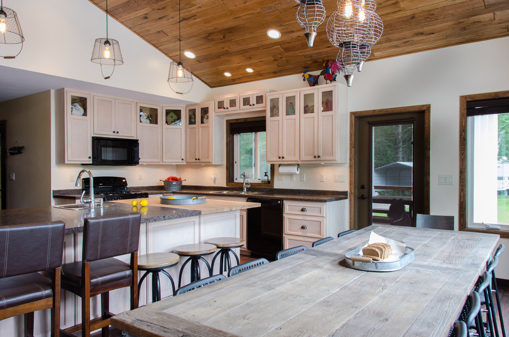 Inspiration for a mid-sized rustic l-shaped linoleum floor open concept kitchen remodel in Boston with a double-bowl sink, shaker cabinets, light wood cabinets, laminate countertops, black appliances and an island