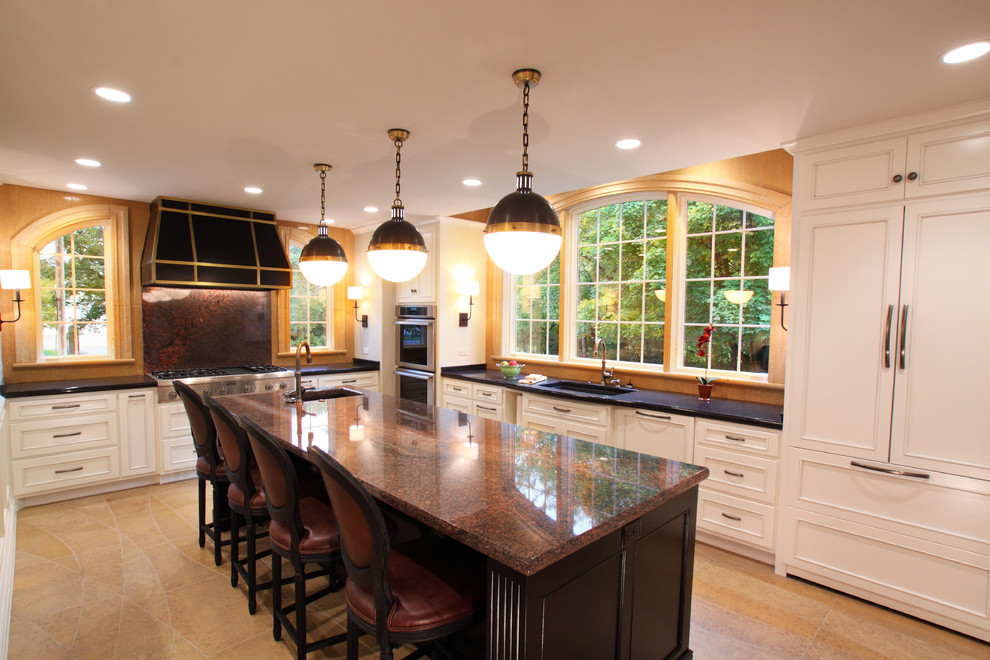 Large elegant l-shaped limestone floor enclosed kitchen photo in Minneapolis with an undermount sink, flat-panel cabinets, white cabinets, laminate countertops, beige backsplash, stone tile backsplash, stainless steel appliances and an island