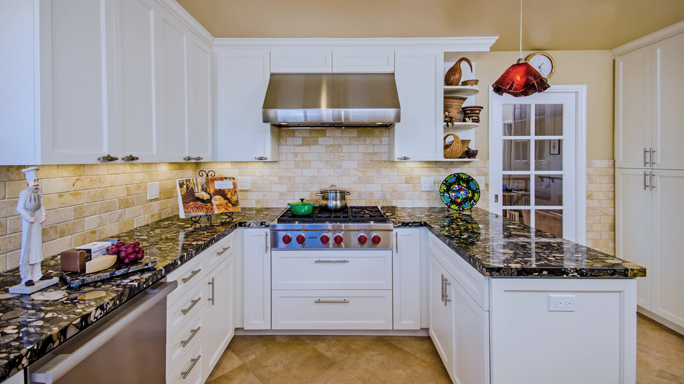 Inspiration for a mid-sized transitional u-shaped porcelain tile enclosed kitchen remodel in San Francisco with an undermount sink, recessed-panel cabinets, white cabinets, granite countertops, yellow backsplash, stone tile backsplash, stainless steel appliances and a peninsula
