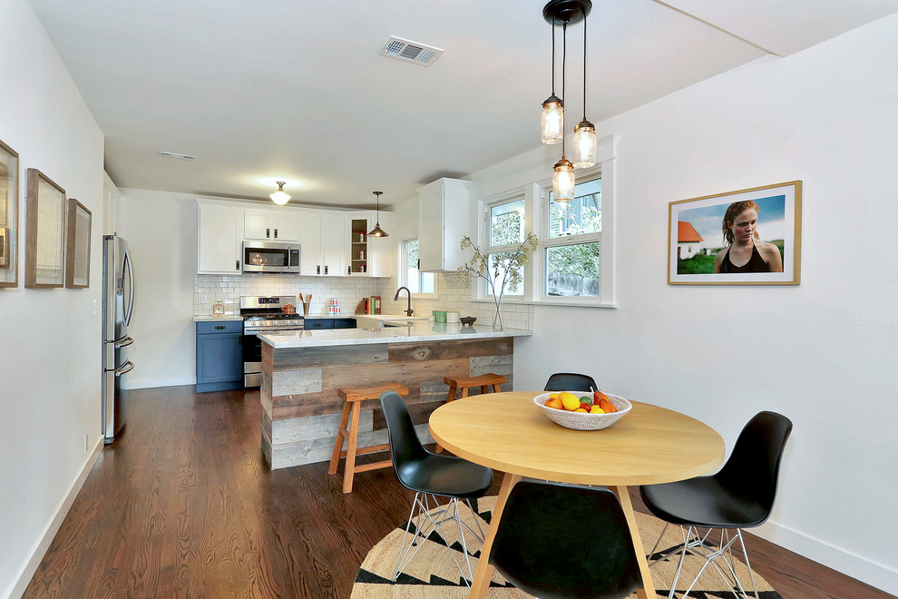 Transitional u-shaped eat-in kitchen photo in Los Angeles with recessed-panel cabinets, blue cabinets, white backsplash, subway tile backsplash and white appliances