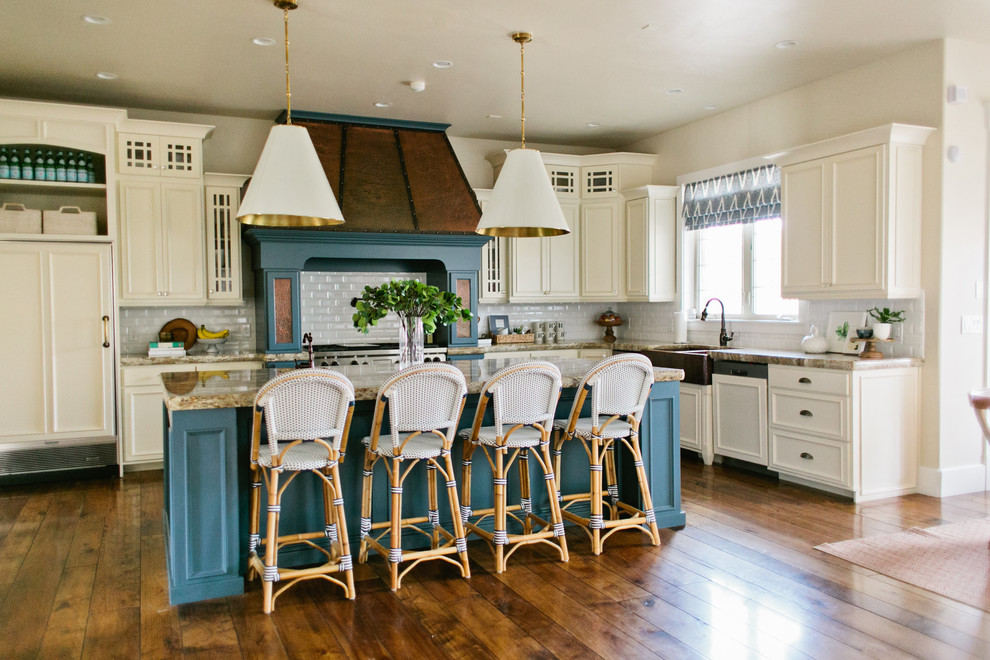 Classic l-shaped open plan kitchen in Salt Lake City with an island.