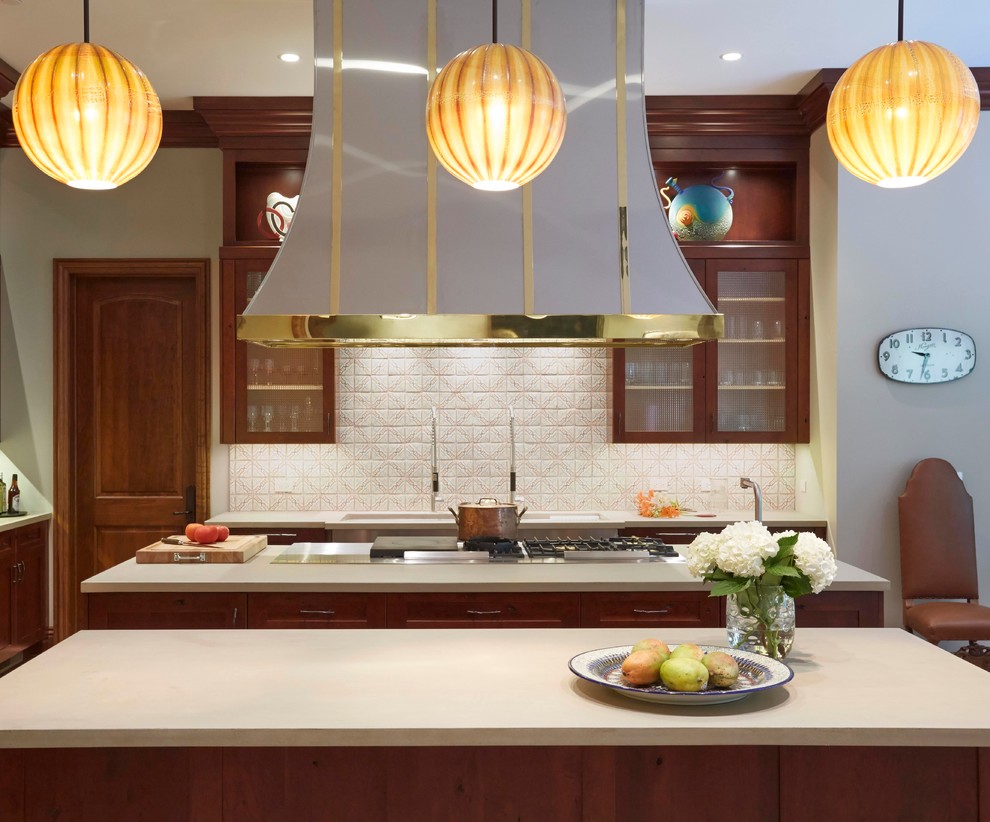 Photo of an expansive traditional galley kitchen/diner in Chicago with glass-front cabinets, dark wood cabinets, beige splashback, multiple islands, a submerged sink, soapstone worktops, ceramic splashback, stainless steel appliances and terracotta flooring.