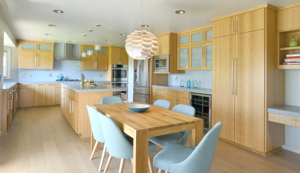Inspiration for a large modern u-shaped light wood floor eat-in kitchen remodel in Sacramento with an undermount sink, light wood cabinets, blue backsplash, stainless steel appliances and an island