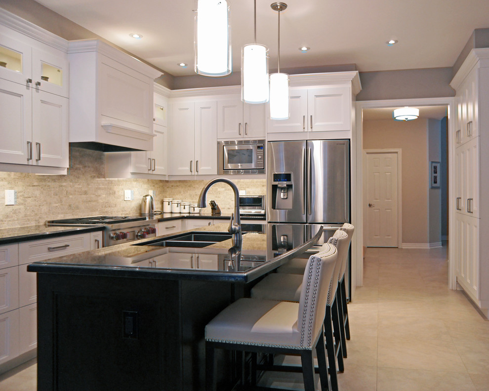 Mid-sized transitional l-shaped porcelain tile eat-in kitchen photo in Toronto with an undermount sink, recessed-panel cabinets, white cabinets, granite countertops, beige backsplash, stone tile backsplash, stainless steel appliances and an island