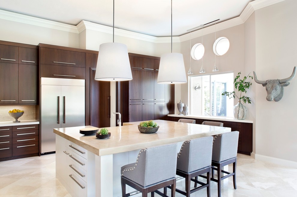 Trendy kitchen photo in Miami with flat-panel cabinets, dark wood cabinets, stainless steel appliances and an island