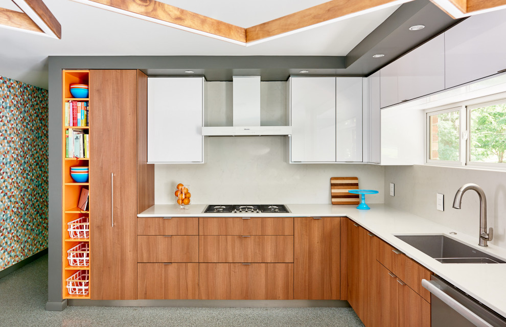 Eat-in kitchen - large 1950s u-shaped terrazzo floor and multicolored floor eat-in kitchen idea in Charlotte with an undermount sink, flat-panel cabinets, medium tone wood cabinets, quartz countertops, white backsplash, quartz backsplash, white appliances and white countertops