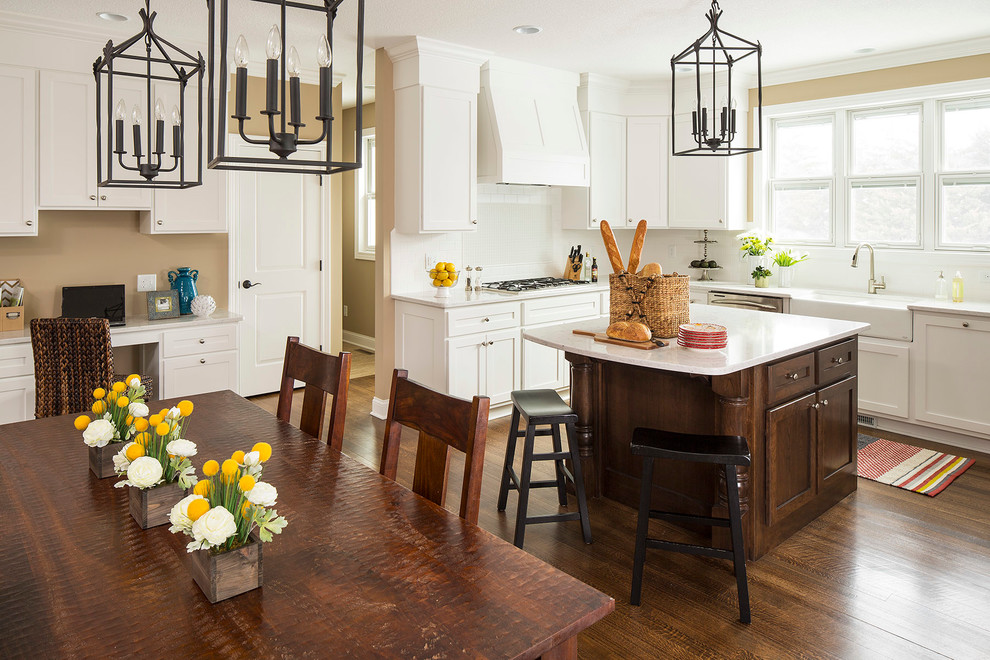 This is an example of a traditional kitchen in Minneapolis with shaker cabinets and a belfast sink.