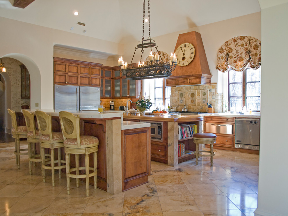 Eat-in kitchen - traditional u-shaped eat-in kitchen idea in Charlotte with an undermount sink, raised-panel cabinets, medium tone wood cabinets, multicolored backsplash, terra-cotta backsplash and stainless steel appliances