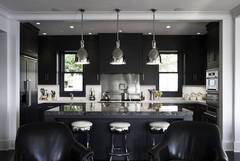 Transitional u-shaped open concept kitchen photo in Boston with recessed-panel cabinets, black cabinets and paneled appliances