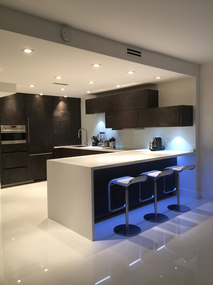 Design ideas for a small modern kitchen in Miami with a built-in sink, brown cabinets, engineered stone countertops, ceramic flooring, an island, white floors and white worktops.