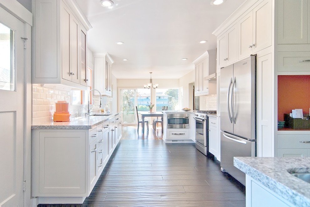 Design ideas for a traditional kitchen/diner in San Francisco with shaker cabinets, white cabinets and stainless steel appliances.