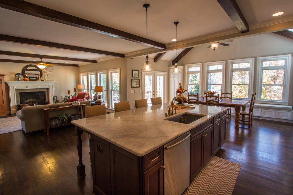 Example of a mid-sized classic single-wall dark wood floor eat-in kitchen design in Atlanta with an undermount sink, shaker cabinets, medium tone wood cabinets, stainless steel appliances, an island, white backsplash, ceramic backsplash and marble countertops