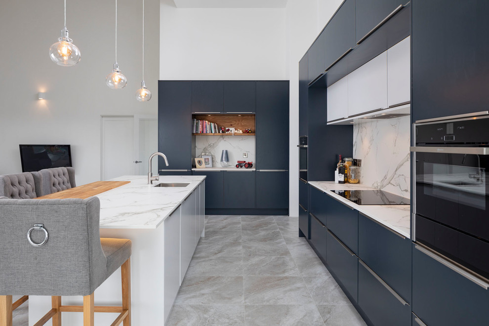 Inspiration for a contemporary kitchen in Other with marble splashback and coloured appliances.