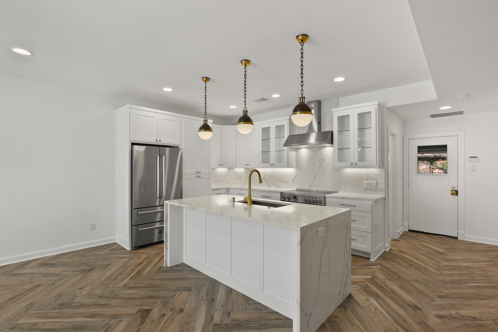 Small minimalist galley porcelain tile and multicolored floor kitchen pantry photo in Dallas with an undermount sink, shaker cabinets, white cabinets, onyx countertops, white backsplash, stainless steel appliances, an island and white countertops