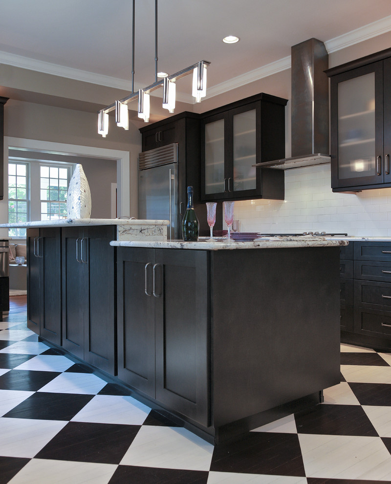 Mid-sized trendy painted wood floor kitchen photo in Baltimore with a farmhouse sink, recessed-panel cabinets, blue cabinets, granite countertops, yellow backsplash, terra-cotta backsplash, stainless steel appliances and an island