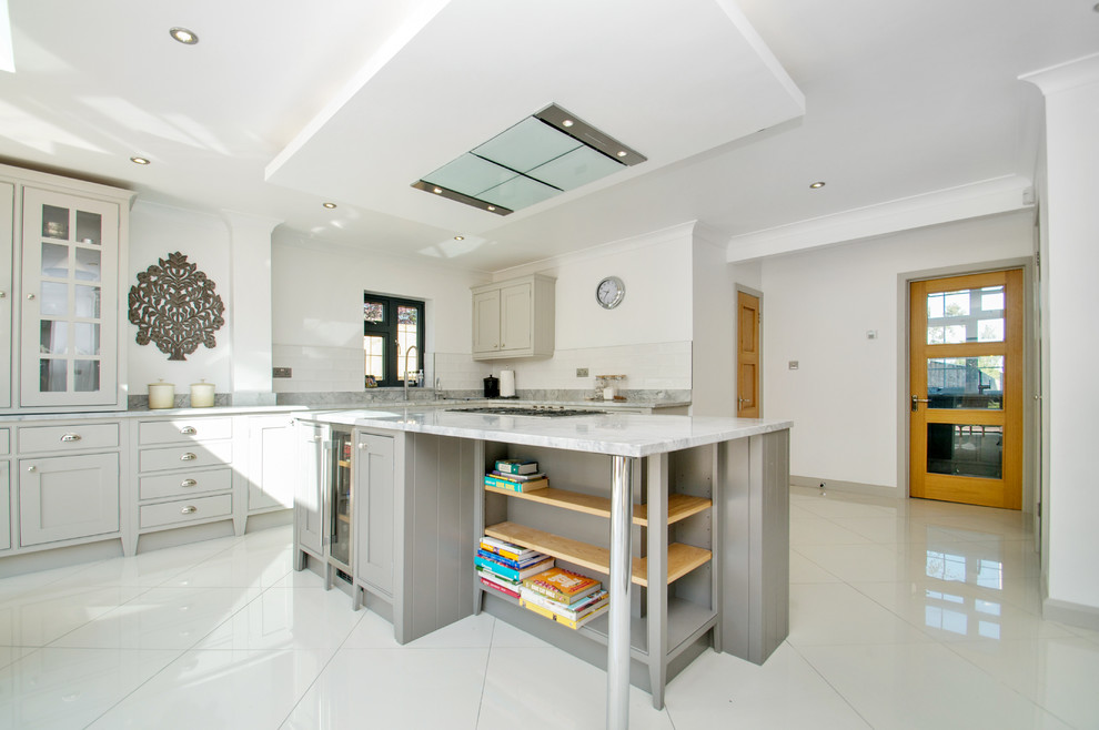 Large classic l-shaped kitchen/diner in Sussex with a built-in sink, beaded cabinets, grey cabinets, marble worktops, stainless steel appliances, ceramic flooring and a breakfast bar.
