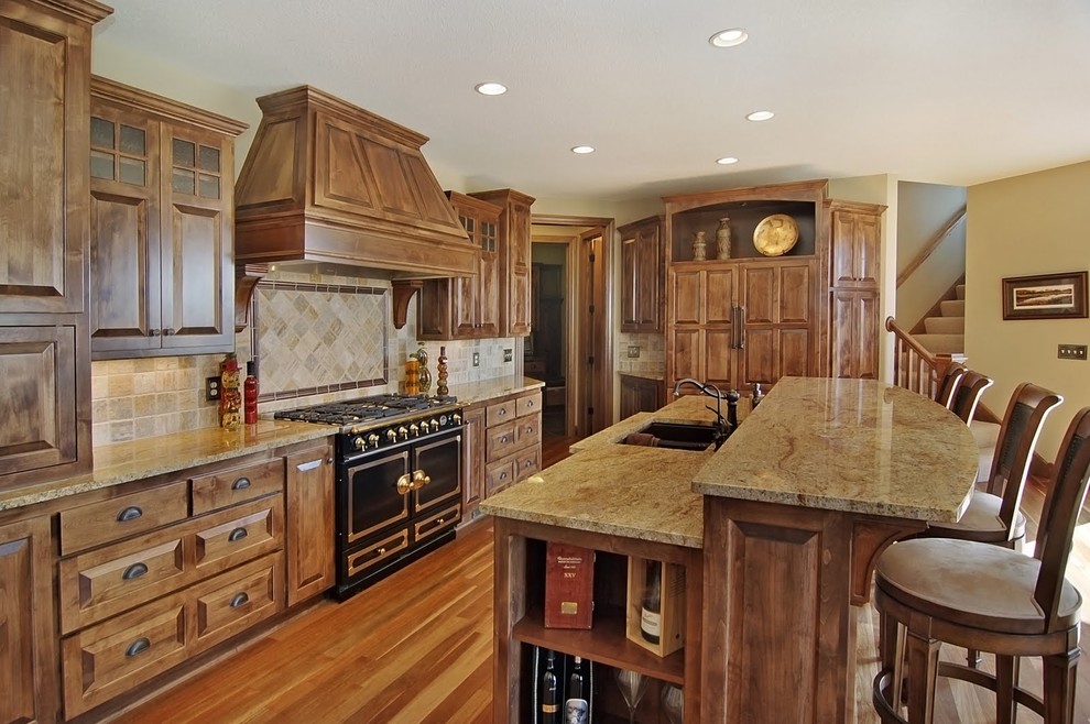Photo of a classic kitchen in Minneapolis with black appliances and granite worktops.