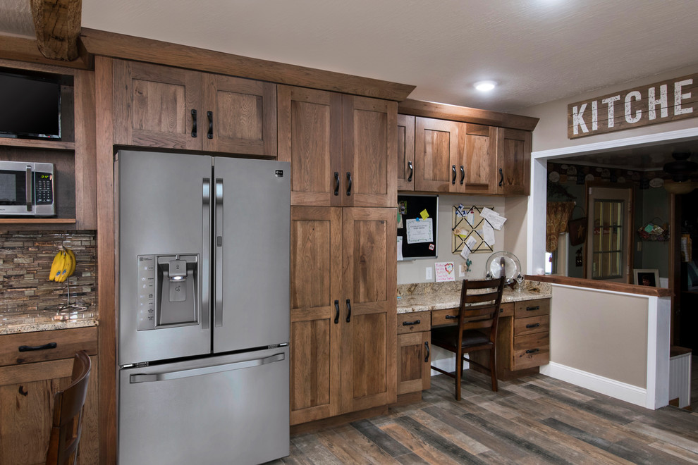 Inspiration for a mid-sized rustic single-wall ceramic tile and multicolored floor open concept kitchen remodel in Columbus with an undermount sink, flat-panel cabinets, medium tone wood cabinets, granite countertops, brown backsplash, glass tile backsplash, stainless steel appliances and an island