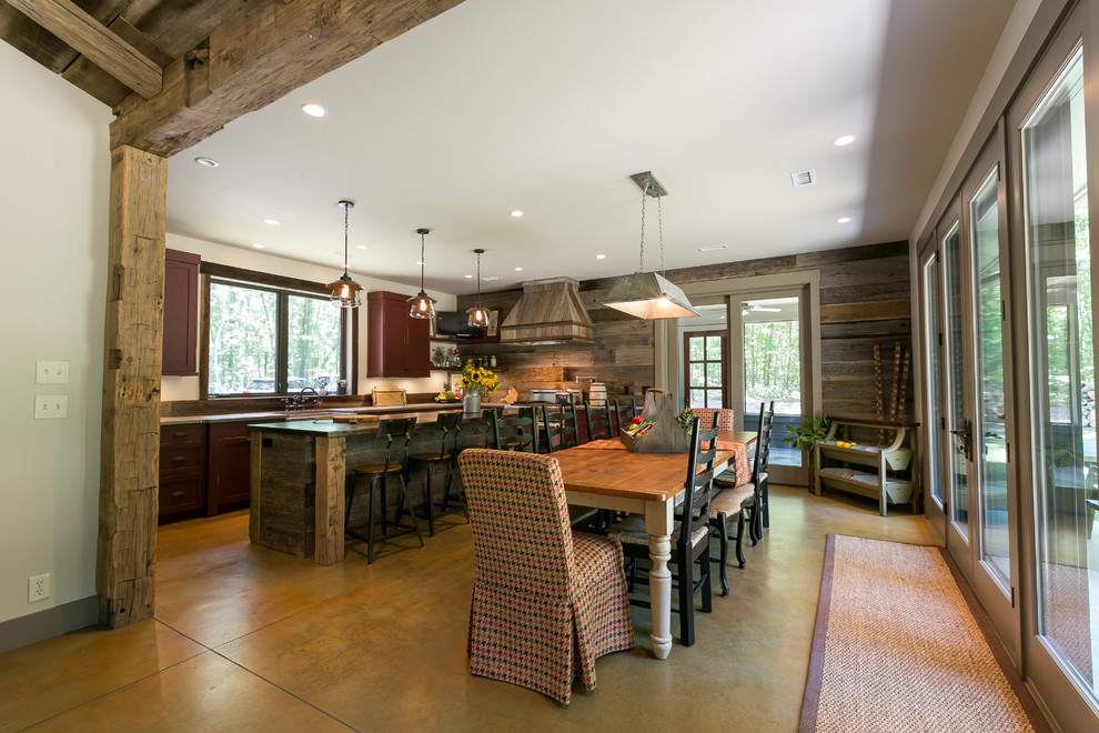 Eat-in kitchen - rustic u-shaped concrete floor eat-in kitchen idea in Charleston with shaker cabinets, distressed cabinets, concrete countertops and an island