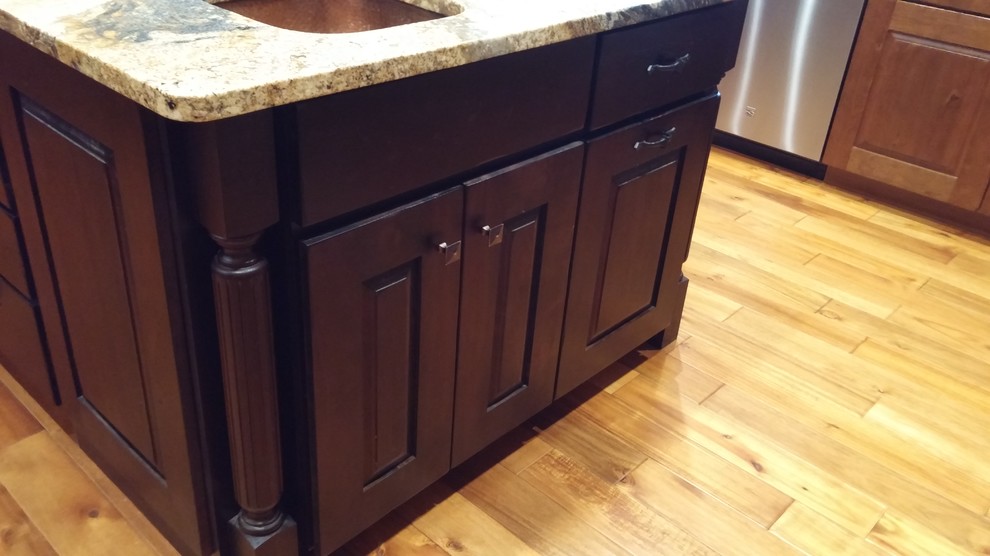 Kitchen - large craftsman u-shaped medium tone wood floor and brown floor kitchen idea in Other with a farmhouse sink, raised-panel cabinets, medium tone wood cabinets, granite countertops, brown backsplash, porcelain backsplash, stainless steel appliances and an island