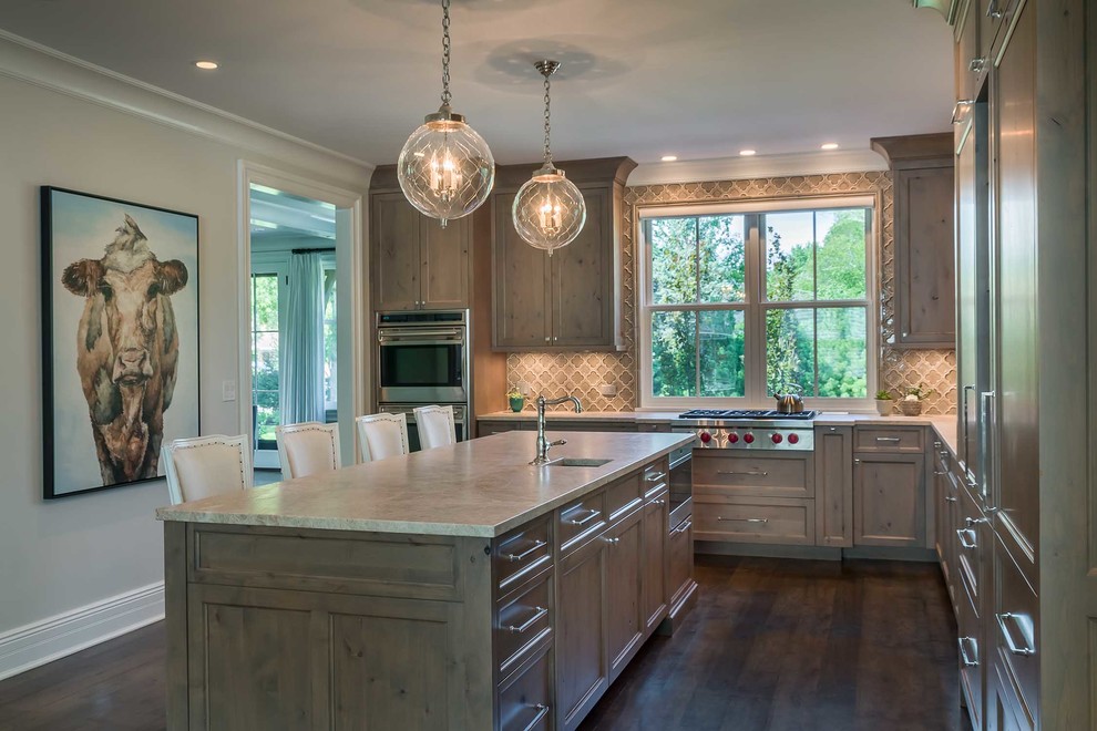 Inspiration for a mid-sized contemporary l-shaped dark wood floor enclosed kitchen remodel in Chicago with an undermount sink, shaker cabinets, gray cabinets, marble countertops, beige backsplash, mosaic tile backsplash, stainless steel appliances and an island