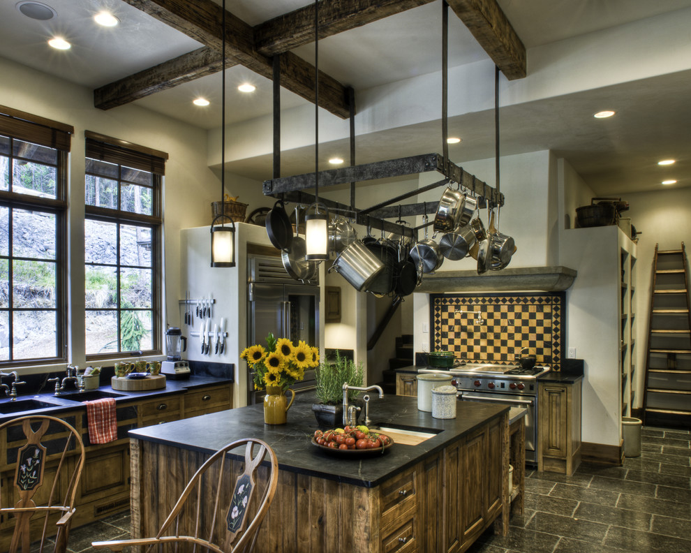 Inspiration for a rustic kitchen remodel in Seattle with stainless steel appliances and soapstone countertops