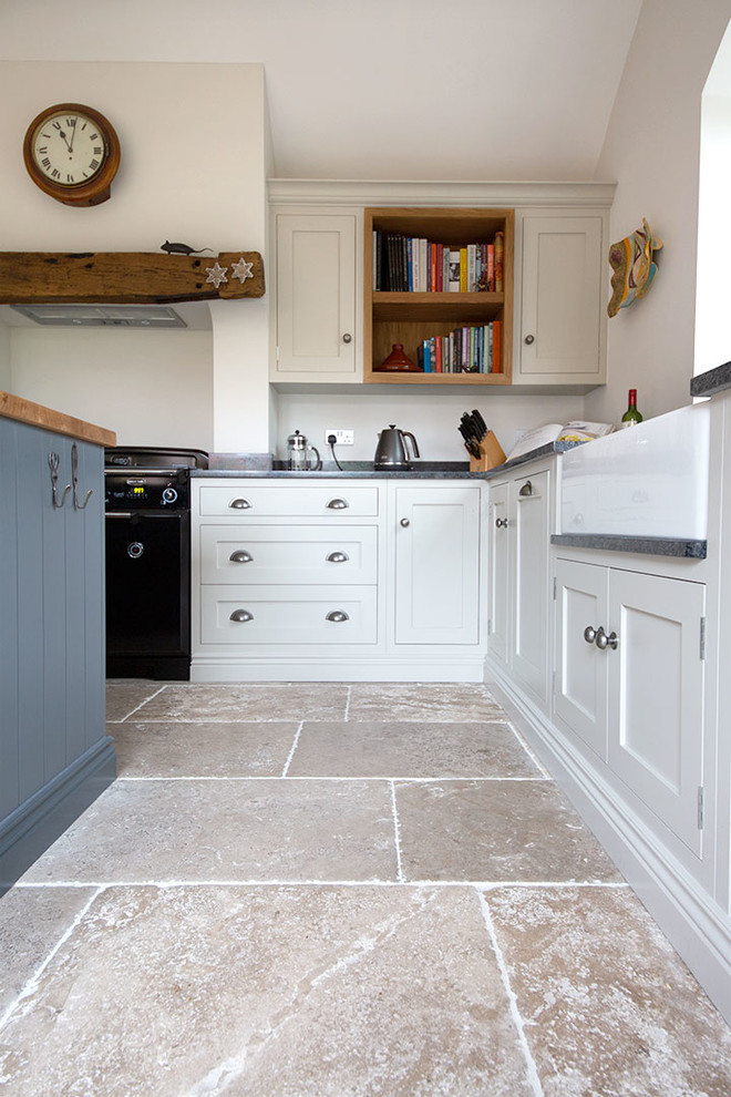 Inspiration for a mid-sized farmhouse limestone floor and beige floor kitchen remodel in Other with an island